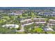 Scenic aerial view overlooking lush landscaping, manicured golf course, and the community's condo buildings at 3750 Pinebrook Cir # 405, Bradenton, FL 34209