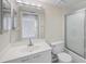 Bright bathroom featuring a vanity with ample storage, mirror, and a shower and tub with glass doors at 3750 Pinebrook Cir # 405, Bradenton, FL 34209