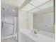 Bathroom featuring a large mirror, vanity, and a walk-in shower with updated fixtures at 3750 Pinebrook Cir # 405, Bradenton, FL 34209