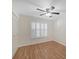 Bedroom features a large window with stylish shutters, ceiling fan and a closet at 3750 Pinebrook Cir # 405, Bradenton, FL 34209