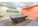 Billiards room featuring a pool table, billiards sign, two chairs, and neutral color scheme at 3750 Pinebrook Cir # 405, Bradenton, FL 34209