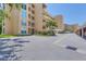Exterior of the condo building shows visitor parking and lush landscaping at 3750 Pinebrook Cir # 405, Bradenton, FL 34209