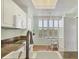 Bright kitchen with white cabinets, granite counters, stainless steel appliances, and a breakfast nook at 3750 Pinebrook Cir # 405, Bradenton, FL 34209