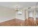 Inviting dining room featuring hardwood floors and seamless kitchen access at 3750 Pinebrook Cir # 405, Bradenton, FL 34209