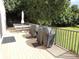 Outdoor patio area featuring a picnic table, two grills, and a view of the lawn at 3750 Pinebrook Cir # 405, Bradenton, FL 34209