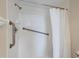 Walk-in shower featuring safety bars and tiled walls at 3750 Pinebrook Cir # 405, Bradenton, FL 34209