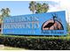 A large sign welcomes visitors to Pinebrook Ironwood Golf Club at 3750 Pinebrook Cir # 405, Bradenton, FL 34209