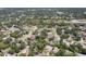 Expansive aerial view of a residential area featuring mature trees and well-maintained homes at 4079 Woodview Dr, Sarasota, FL 34232