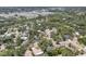 Aerial view showcasing the neighborhood with beautiful trees and convenient access to the river at 4079 Woodview Dr, Sarasota, FL 34232