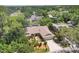 Scenic aerial view of a home nestled within a lush, green residential neighborhood at 4079 Woodview Dr, Sarasota, FL 34232