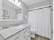 Well-lit bathroom with a marble vanity and modern fixtures at 4079 Woodview Dr, Sarasota, FL 34232