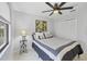 Comfortable bedroom with ceiling fan and bright natural light at 4079 Woodview Dr, Sarasota, FL 34232