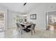 Contemporary dining room featuring a modern light fixture, and shuttered window at 4079 Woodview Dr, Sarasota, FL 34232