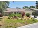 Charming single-story home with well-manicured landscaping and a cozy, inviting curb appeal at 4079 Woodview Dr, Sarasota, FL 34232