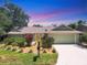 Inviting single-Gathering home with a well-kept lawn and vibrant tropical plants enhancing the curb appeal at 4079 Woodview Dr, Sarasota, FL 34232