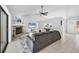 Bright living room featuring a fireplace, vaulted ceiling, and modern ceiling fan at 4079 Woodview Dr, Sarasota, FL 34232