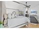Bright main bedroom with a four poster bed, fireplace, and view of the pool at 4079 Woodview Dr, Sarasota, FL 34232