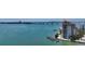 Stunning aerial view of a waterfront condo featuring a private pool and scenic bay views at 420 Golden Gate Pt # 200A, Sarasota, FL 34236