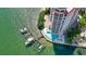 Aerial view of a waterfront building features boat docks and waterfront access at 420 Golden Gate Pt # 200A, Sarasota, FL 34236