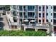 Balcony view features outdoor seating, a grill, and access to waterfront at 420 Golden Gate Pt # 200A, Sarasota, FL 34236