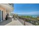Spacious balcony with built-in grill and endless bay views, a great spot to unwind and enjoy the outdoors at 420 Golden Gate Pt # 200A, Sarasota, FL 34236