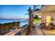 Exterior showcasing a spacious balcony with lounge chairs and gorgeous water views at 420 Golden Gate Pt # 200A, Sarasota, FL 34236