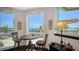 Cozy breakfast nook with water view, perfect for enjoying meals with a scenic backdrop at 420 Golden Gate Pt # 200A, Sarasota, FL 34236