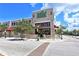A two story retail store with a clean facade, street trees, and a well maintained surrounding streetscape at 420 Golden Gate Pt # 200A, Sarasota, FL 34236