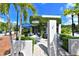 Charming bistro with outdoor seating, framed by lush greenery and palm trees at 420 Golden Gate Pt # 200A, Sarasota, FL 34236