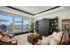 Cozy condo living area with a water view balcony, custom built-ins, and comfortable seating at 420 Golden Gate Pt # 200A, Sarasota, FL 34236