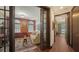 Warm and inviting office with French doors, multiple windows, hardwood floors, and comfortable seating at 420 Golden Gate Pt # 200A, Sarasota, FL 34236