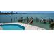 A waterfront pool is steps from the bay and the private boat dock at 420 Golden Gate Pt # 200A, Sarasota, FL 34236