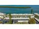 Aerial of waterfront condo building with convenient covered parking at 4420 Exeter Dr # L104, Longboat Key, FL 34228