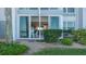 Exterior view of a balcony with sliding glass doors that offer view into the living area at 4420 Exeter Dr # L104, Longboat Key, FL 34228