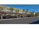 Well-maintained condo parking area with carports and lush landscaping at 4420 Exeter Dr # L104, Longboat Key, FL 34228