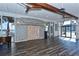Beautiful event space with wood floors, exposed beams, and plenty of natural light from the large windows at 4420 Exeter Dr # L104, Longboat Key, FL 34228
