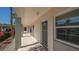 Exterior hallway with well-kept walkway and beautiful garden view at 4420 Exeter Dr # L104, Longboat Key, FL 34228