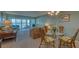 Inviting living room with water views and comfortable seating arrangement at 4420 Exeter Dr # L104, Longboat Key, FL 34228