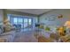 Cozy living room with comfortable seating, scenic water views, and coastal decor at 4420 Exeter Dr # L104, Longboat Key, FL 34228