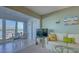 Bright living room with water views and charming dining space at 4420 Exeter Dr # L104, Longboat Key, FL 34228