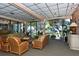 Inviting lobby with comfortable seating, stylish decor, and abundant natural light streaming through the large windows at 4420 Exeter Dr # L104, Longboat Key, FL 34228
