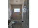 Bright bathroom features a tiled shower/bath combo, granite vanity, and neutral finishes at 4444 Swift Rd # 14, Sarasota, FL 34231