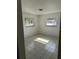 Bright bedroom with tile floors and two large windows, creating a comfortable living space at 4444 Swift Rd # 14, Sarasota, FL 34231