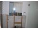 Bathroom in disrepair shows a shower with tile and a broken mirror at 4621 Gulf Of Mexico Dr # 2F, Longboat Key, FL 34228