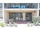 Outdoor patio area with slider to interior at 4621 Gulf Of Mexico Dr # 2F, Longboat Key, FL 34228