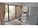 Storage room with access to the patio, featuring a washer, dryer, and room for other items at 4621 Gulf Of Mexico Dr # 2F, Longboat Key, FL 34228