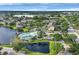 An aerial view of a lakeside community featuring lush landscaping and multiple buildings at 4802 51St W St # 1711, Bradenton, FL 34210