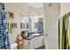 Functional bathroom featuring a vanity with mirror and standard fixtures and a door at 4802 51St W St # 1711, Bradenton, FL 34210