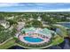 A beautiful aerial view of the community pool and gathering space located lakeside at 4802 51St W St # 1711, Bradenton, FL 34210