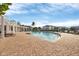 Resort-style pool with sun loungers and a covered pergola at 4802 51St W St # 1711, Bradenton, FL 34210